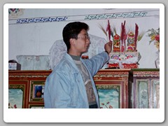 Chomba (our guide) discussing objects on the cabinet