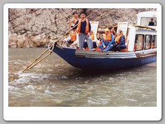 A boat with tourists caught on the shoallow bottom